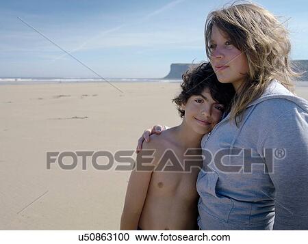 "Brother and sister together on beach, portrait" View Large Photo Image Stock Image - "Brother and sister together on beach, portrait". Fotosearch