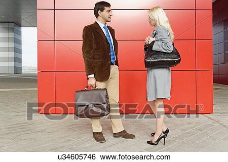 "Businessman and businesswoman, standing face to face" View Large Photo Image Stock Photograph - "Businessman and businesswoman, standing face to face". Fotosearch