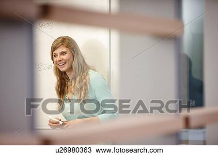 Businesswoman presenting at whiteboard in office View Large Photo Image Stock Image - Businesswoman presenting at whiteboard in office. Fotosearch