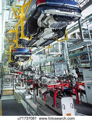 Car bodies and engines in car factory View Large Photo Image Stock Image - Car bodies and engines in car factory. Fotosearch