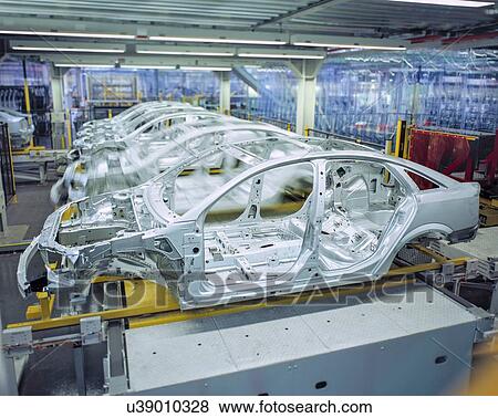 Stock Photo - Car bodies on production line in car factory. Fotosearch