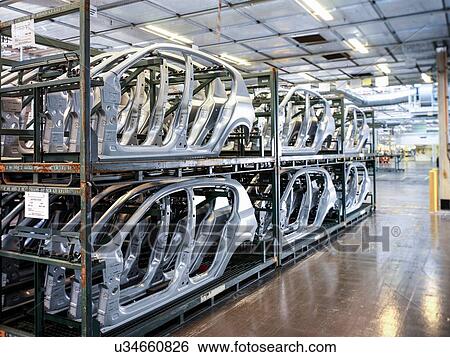 Stock Photograph - Car body parts in storage in car factory. Fotosearch