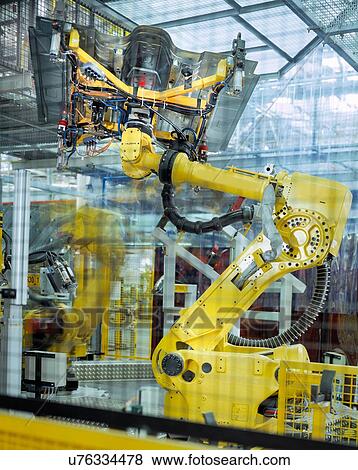 Car body welding robots in car factory View Large Photo Image Stock Photo - Car body welding robots in car factory. Fotosearch
