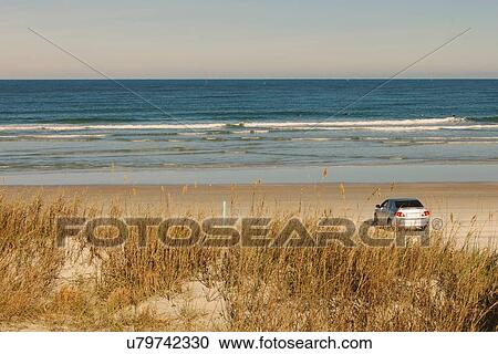 Stock Image - "Car parked on New Smyrna Beach, Florida, USA". Fotosearch