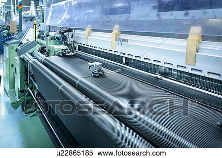 Stock Photography - Carbon fibre loom in detail in carbon fibre factory. Fotosearch