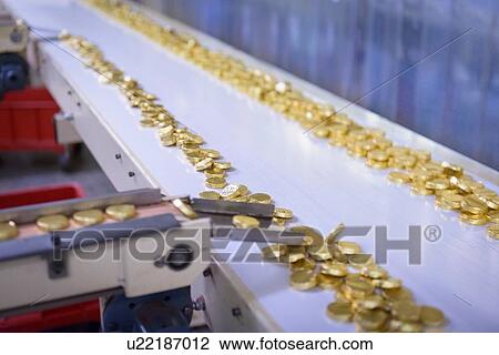 Chocolates on production line in chocolate factory View Large Photo Image Stock Image - Chocolates on production line in chocolate factory. Fotosearch