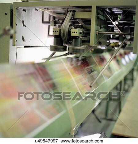 Close up of folding machine in printworks View Large Photo Image Stock Photo - Close up of folding machine in printworks. Fotosearch