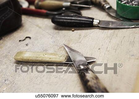 Close up of knives on bench in shoe makers workshop View Large Photo Image Stock Photo - Close up of knives on bench in shoe makers workshop. Fotosearch