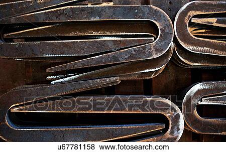 Close-up of metal shapes in factory View Large Photo Image Stock Photo - Close-up of metal shapes in factory. Fotosearch