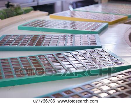 Stock Photograph - Close up of moulded chocolates in chocolate factory. Fotosearch