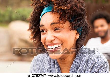 Stock Photo - "Close up of smiling young woman on Ipanema Beach, Rio De Janeiro, Brazil". Fotosearch