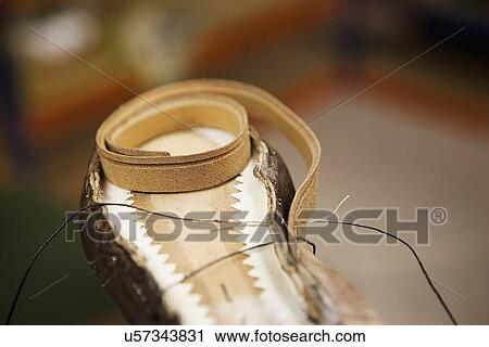 Close up of thread and shoe leather in shoe makers workshop View Large Photo Image Stock Image - Close up of thread and shoe leather in shoe makers workshop. Fotosearch