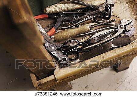 Stock Photograph - Close up of tool box and hand tools in shoe makers workshop. Fotosearch