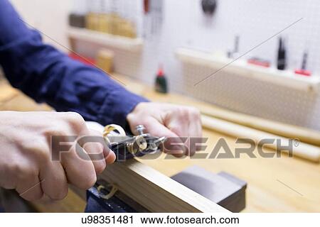 Close up of young female carpenters hands planing timber in workshop vice View Large Photo Image Stock Image - Close up of young female carpenters hands planing timber in workshop vice. Fotosearch