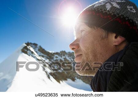 "Close up portrait of hiker in snow covered mountains, Jungfrauchjoch, Grindelwald, Switzerland" View Large Photo Image Stock Photography - "Close up portrait of hiker in snow covered mountains, Jungfrauchjoch, Grindelwald, Switzerland". Fotosearch
