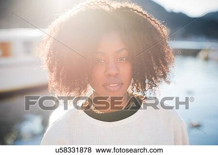 Stock Photo - "Close up portrait of young woman, Lake Como, Italy". Fotosearch