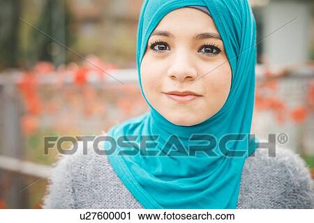 Close up portrait of young woman wearing turquoise hijab View Large Photo Image Stock Image - Close up portrait of young woman wearing turquoise hijab. Fotosearch