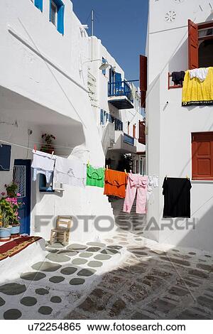 Stock Photography - "Clothes line in house courtyard, Mykonos, Cyclades, Greece". Fotosearch