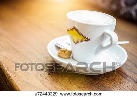 Coffee cup on table View Large Photo Image Stock Photo - Coffee cup on table. Fotosearch