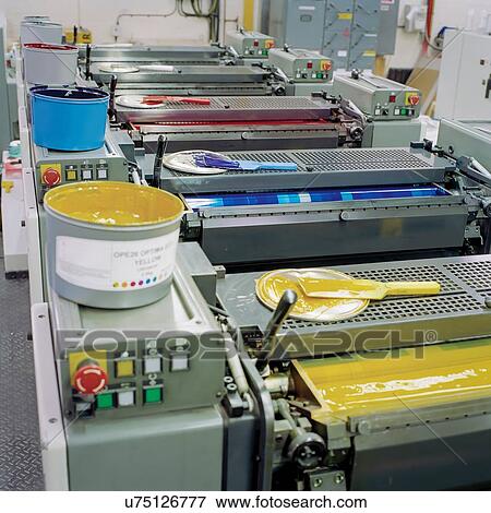 Stock Photo - Coloured inks on printing machine in printworks. Fotosearch