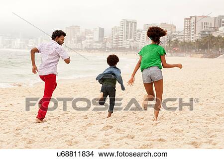 "Couple and son enjoying beach, Rio de Janeiro, Brazil" View Large Photo Image Picture - "Couple and son enjoying beach, Rio de Janeiro, Brazil". Fotosearch