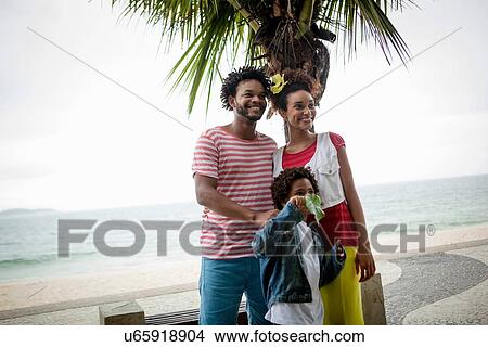 Picture - "Couple and son on Ipanema beach, Rio De Janeiro, Brazil". Fotosearch
