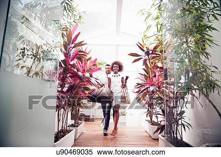 Couple arriving into apartment building View Large Photo Image Stock Photography - Couple arriving into apartment building. Fotosearch