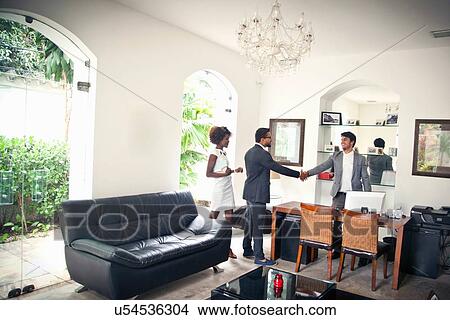 Picture - Couple being welcomed on arrival. Fotosearch