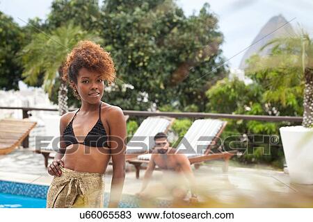 "Couple by terrace pool, Sugarloaf Mountain in background, RIo, Brazil" View Large Photo Image Stock Image - "Couple by terrace pool, Sugarloaf Mountain in background, RIo, Brazil". Fotosearch