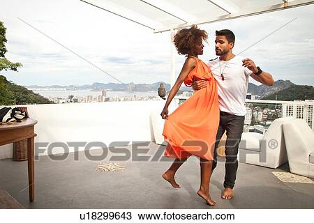 "Couple dancing on terrace, Sugarloaf Mountain in background, Rio, Brazil" View Large Photo Image Stock Image - "Couple dancing on terrace, Sugarloaf Mountain in background, Rio, Brazil". Fotosearch