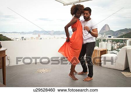 "Couple dancing on terrace, Sugarloaf Mountain in background, Rio, Brazil" View Large Photo Image Stock Image - "Couple dancing on terrace, Sugarloaf Mountain in background, Rio, Brazil". Fotosearch