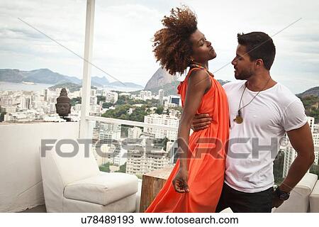 "Couple dancing on terrace, Sugarloaf Mountain in background, Rio, Brazil" View Large Photo Image Stock Image - "Couple dancing on terrace, Sugarloaf Mountain in background, Rio, Brazil". Fotosearch