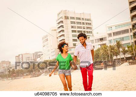 "Couple enjoying beach, Rio de Janeiro, Brazil" View Large Photo Image Stock Photography - "Couple enjoying beach, Rio de Janeiro, Brazil". Fotosearch