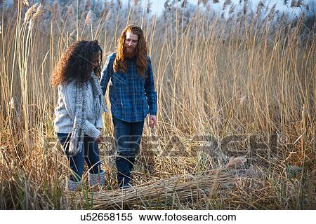 Couple harvesting wheat View Large Photo Image Stock Photography - Couple harvesting wheat. Fotosearch