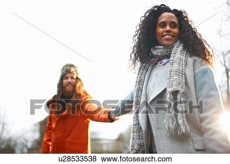 Stock Photo - Couple holding hands. Fotosearch