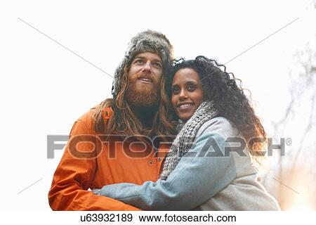 Couple hugging each other View Large Photo Image Stock Photo - Couple hugging each other. Fotosearch