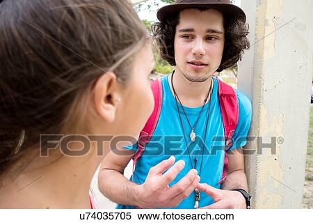 Couple talking outdoors View Large Photo Image Stock Photography - Couple talking outdoors. Fotosearch