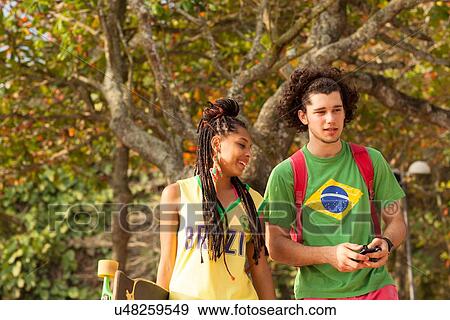 "Couple walking in park, Rio de Janeiro, Brazil" View Large Photo Image Stock Photo - "Couple walking in park, Rio de Janeiro, Brazil". Fotosearch