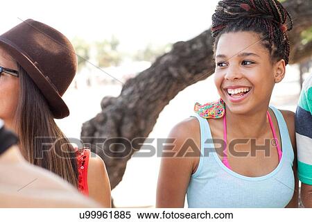 "Cropped shot of adult friends chatting and laughing on sidewalk, Copacabana, Rio De Janeiro, Brazil" View Large Photo Image Stock Photography - "Cropped shot of adult friends chatting and laughing on sidewalk, Copacabana, Rio De Janeiro, Brazil". Fotosearch