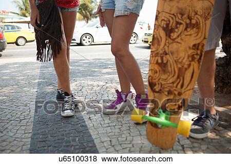 "Cropped shot of skateboarders legs on sidewalk, Copacabana, Rio De Janeiro, Brazil" View Large Photo Image Stock Photo - "Cropped shot of skateboarders legs on sidewalk, Copacabana, Rio De Janeiro, Brazil". Fotosearch