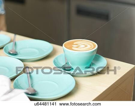 Stock Image - Cup of coffee and saucers. Fotosearch