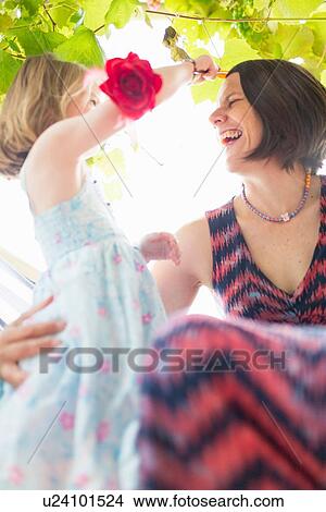 Daughter combing mother's hair View Large Photo Image Picture - Daughter combing mother's hair. Fotosearch