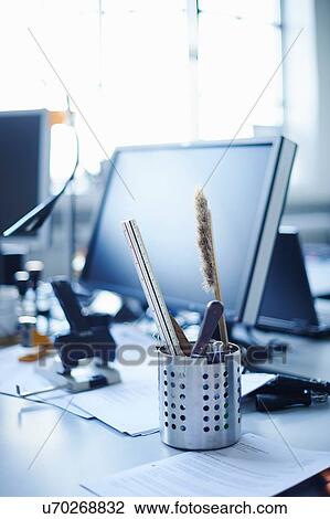 Desk tidy and personal computer on office desk View Large Photo Image Stock Image - Desk tidy and personal computer on office desk. Fotosearch