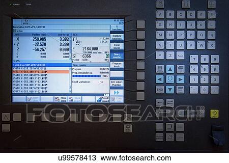 Stock Image - Detail of CNC machine screen in engineering factory. Fotosearch