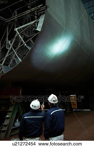 "Detail of ship in shipyard, with workers looking on, GoSeong-gun, South Korea" View Large Photo Image Picture - "Detail of ship in shipyard, with workers looking on, GoSeong-gun, South Korea". Fotosearch