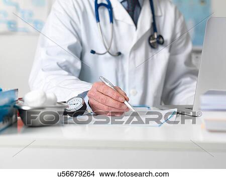 Picture - Doctor checking medical notes before prescribing treatment. Fotosearch