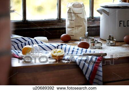 Stock Image - "Eggs, lemon and flour on kitchen counter". Fotosearch