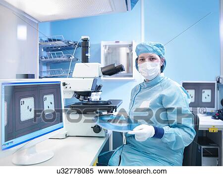 "Electronics worker in clean room with silicon wafer, portrait" View Large Photo Image Stock Photography - "Electronics worker in clean room with silicon wafer, portrait". Fotosearch