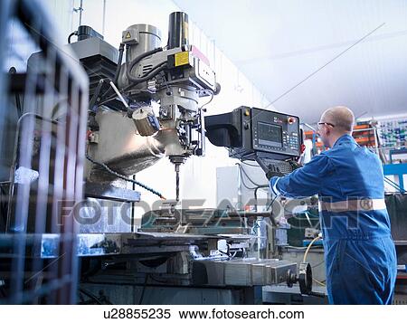 Engineer using lathe in engineering factory View Large Photo Image Stock Photography - Engineer using lathe in engineering factory. Fotosearch