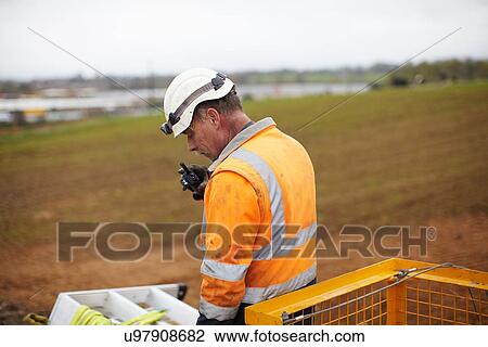 Engineer working at wind farm View Large Photo Image Stock Image - Engineer working at wind farm. Fotosearch